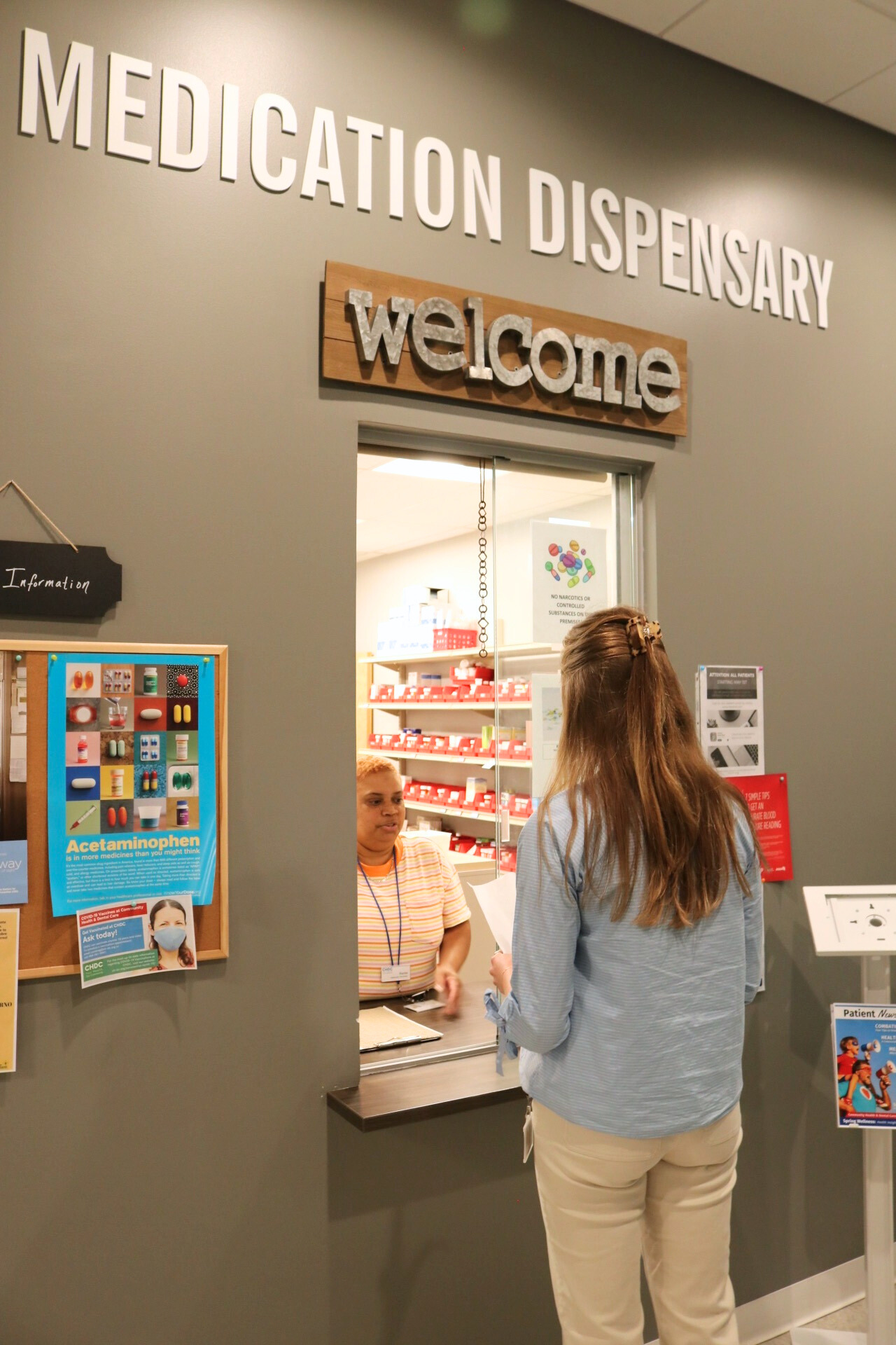 Patient at the Dispensary window seeking medication.