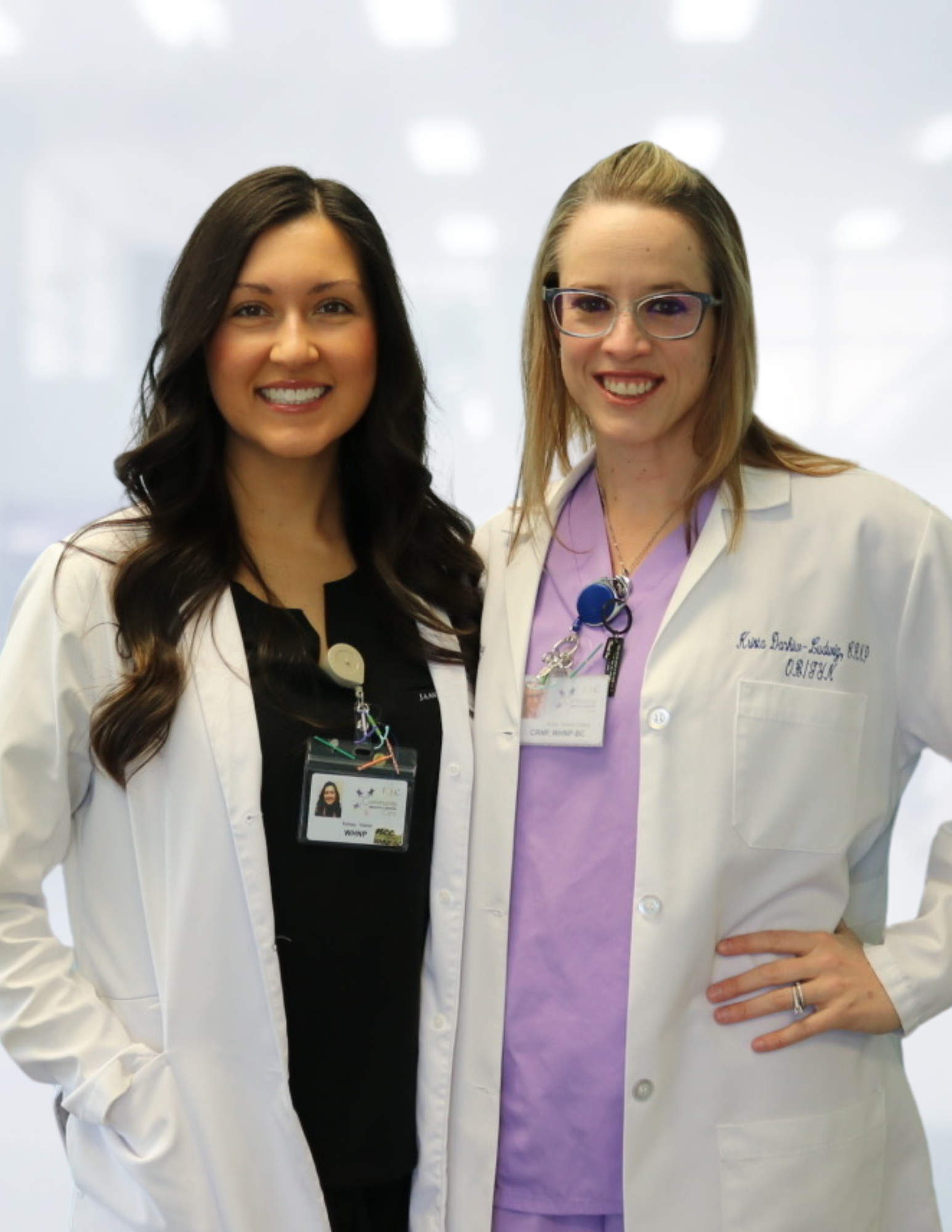 Women's Health OB/GYN Providers Kelsey Waller and Krista Dankiw-Ludwig posing for a photo in the office.